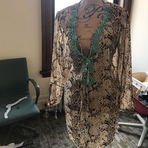 Sexy coverup/ tunic w/ beautiful detail neckline. Elegant and trendy